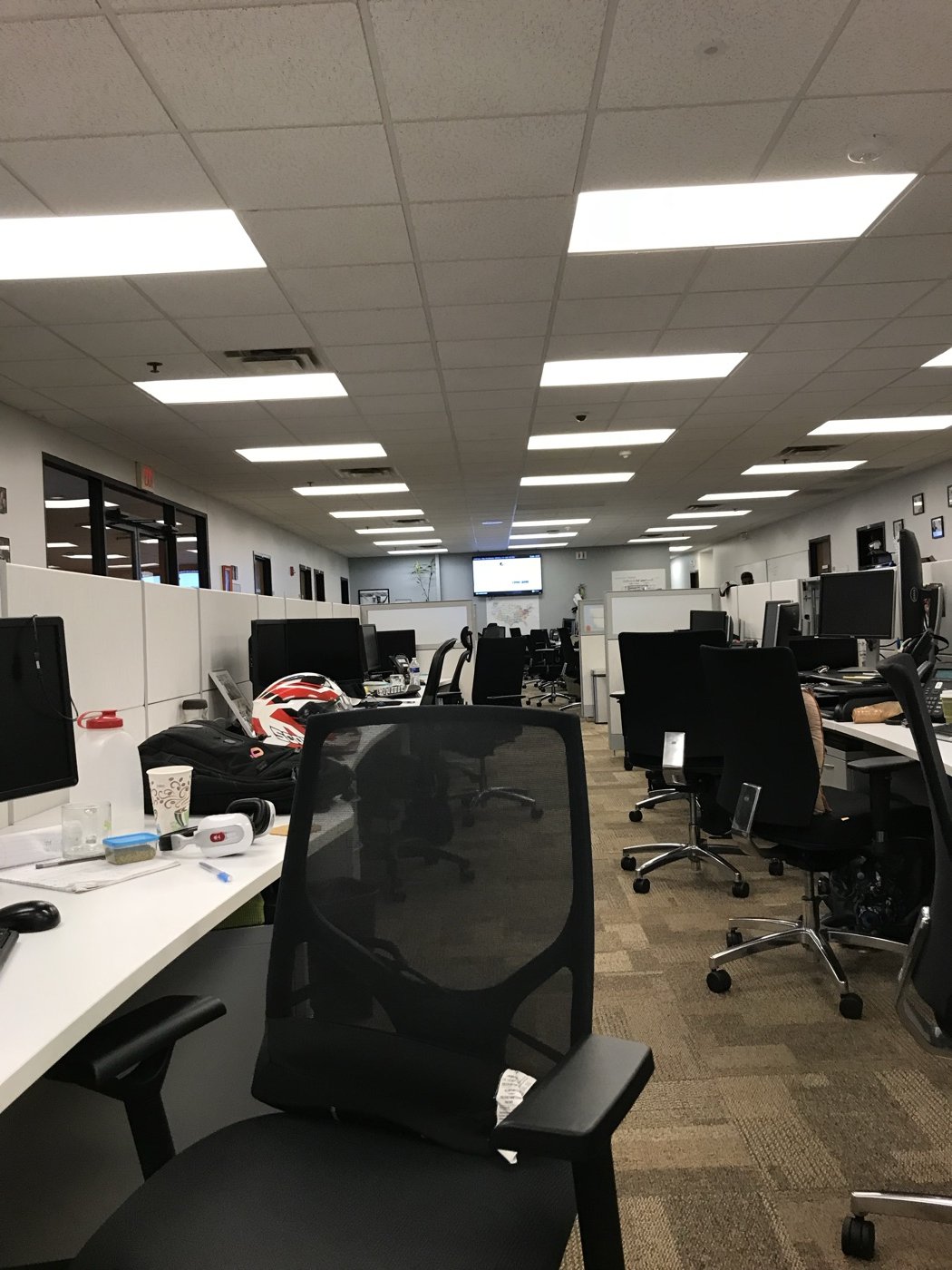 The Amdocs Comcast division office floor, the row of desks of the team Vinny Govea led.
